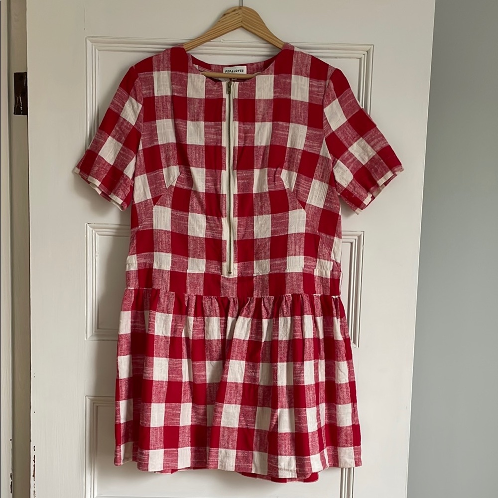 Red and white gingham dress with zip up front. 100% cotton.